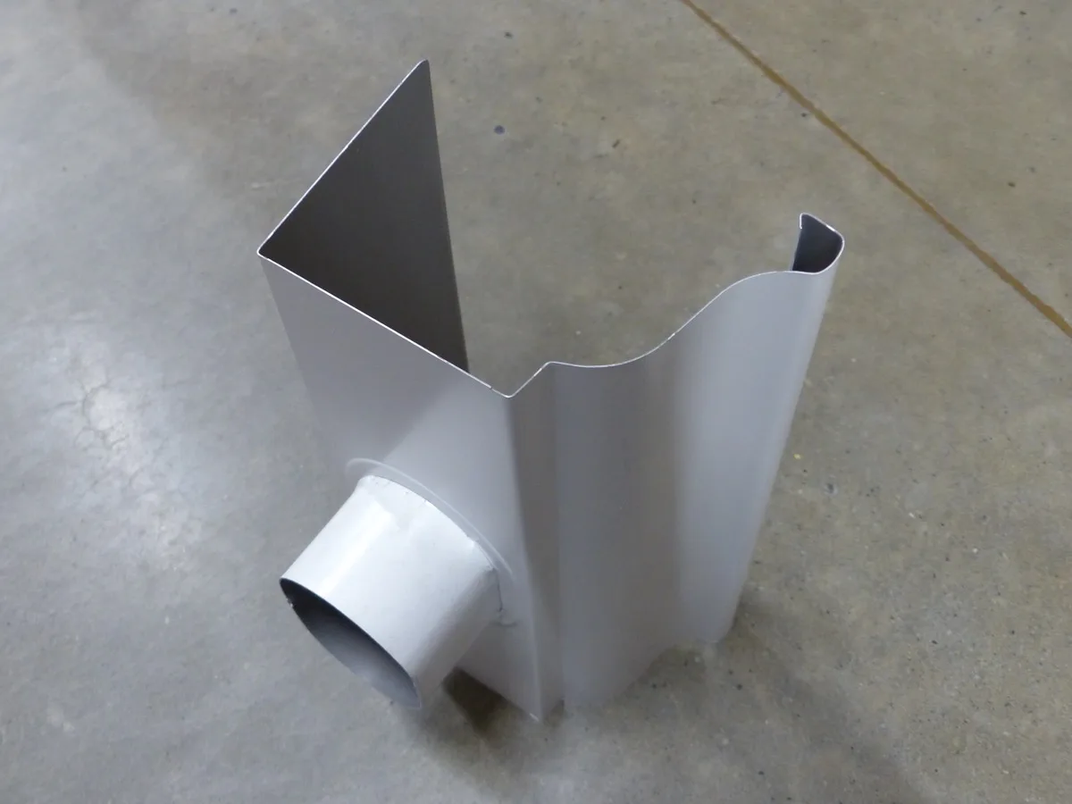 K-style seamless aluminum gutter section showing the flat back and ogee-profile front