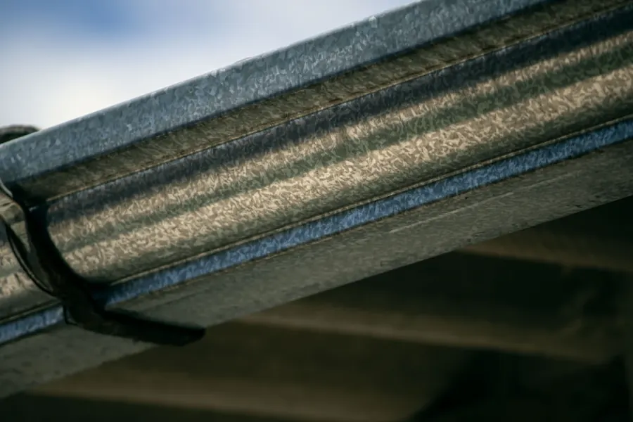 Galvanized steel gutter trough with early internal corrosion along the bead lines on an older Mint Hill NC home