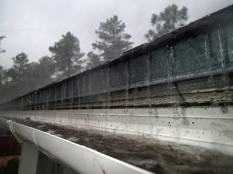 Gutter overflowing in heavy Charlotte NC rainstorm
